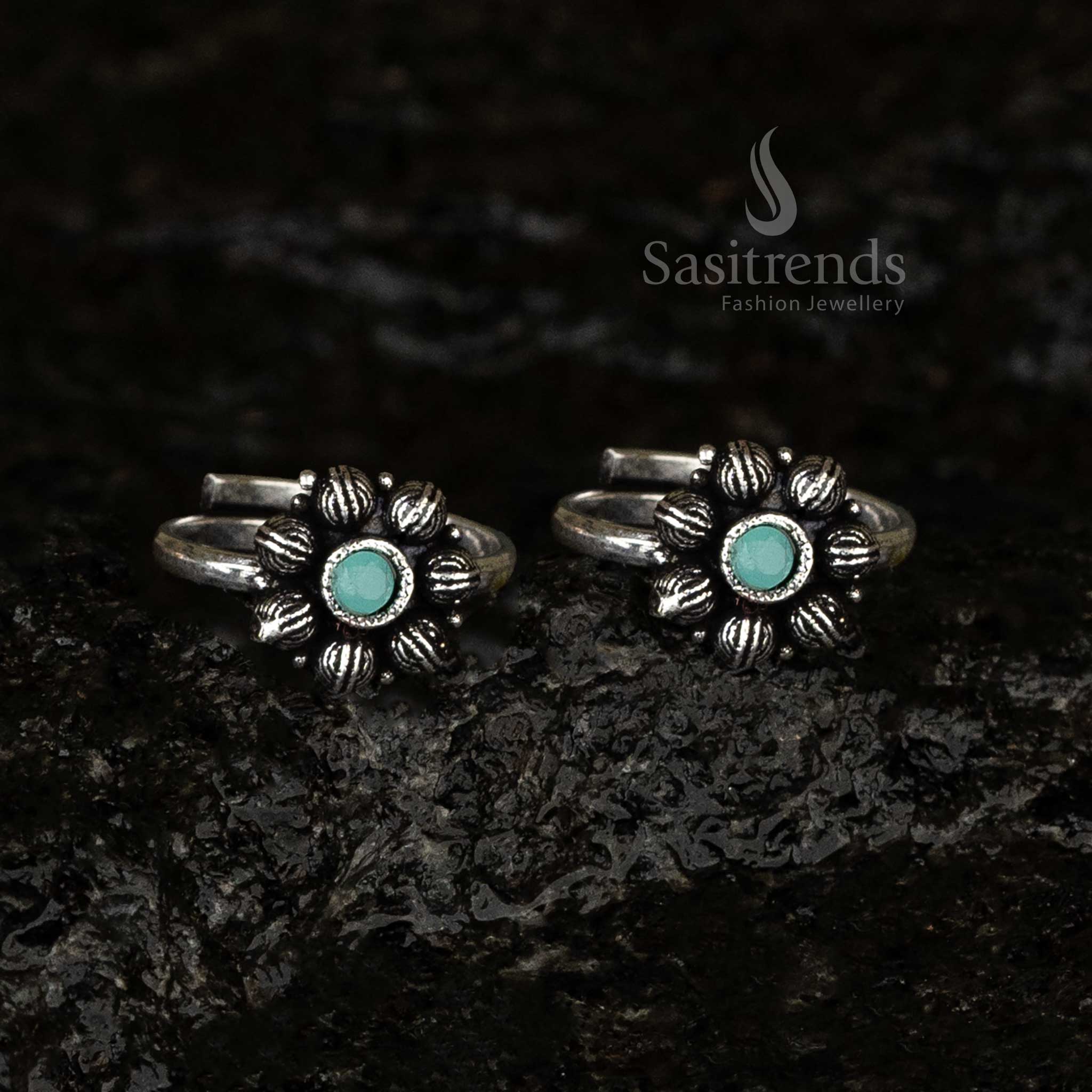 Oxidised adjustable toe ring with a pastel mint green stone surrounded by a delicate petal motif, creating a soothing vintage-inspired look - Sasitrends