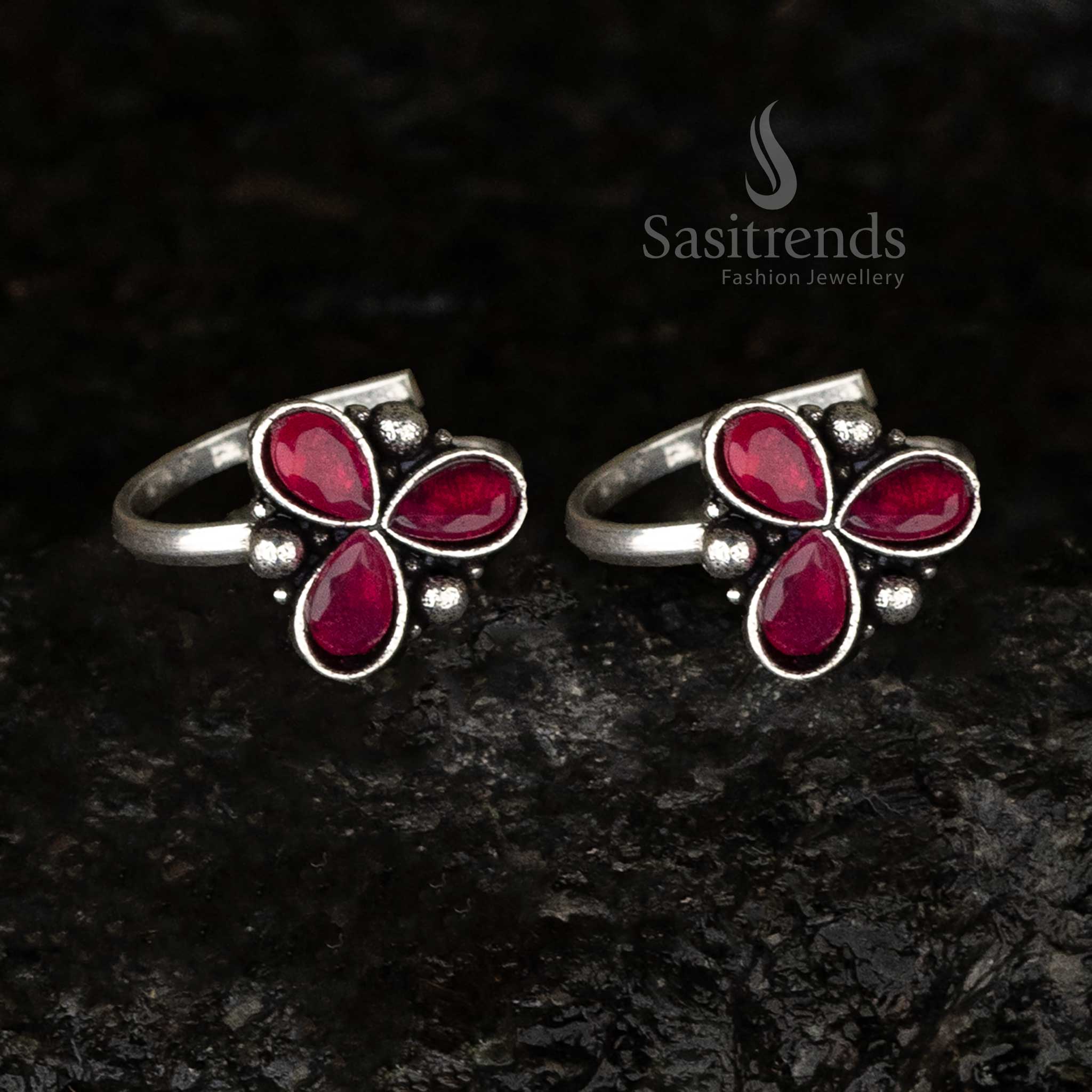 Oxidised toe ring showcasing three crimson ruby teardrop stones complemented by bead accents, radiating a regal and royal charm - Sasitrends