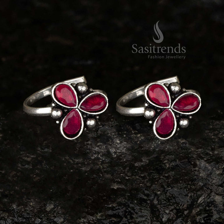 Oxidised toe ring showcasing three crimson ruby teardrop stones complemented by bead accents, radiating a regal and royal charm - Sasitrends