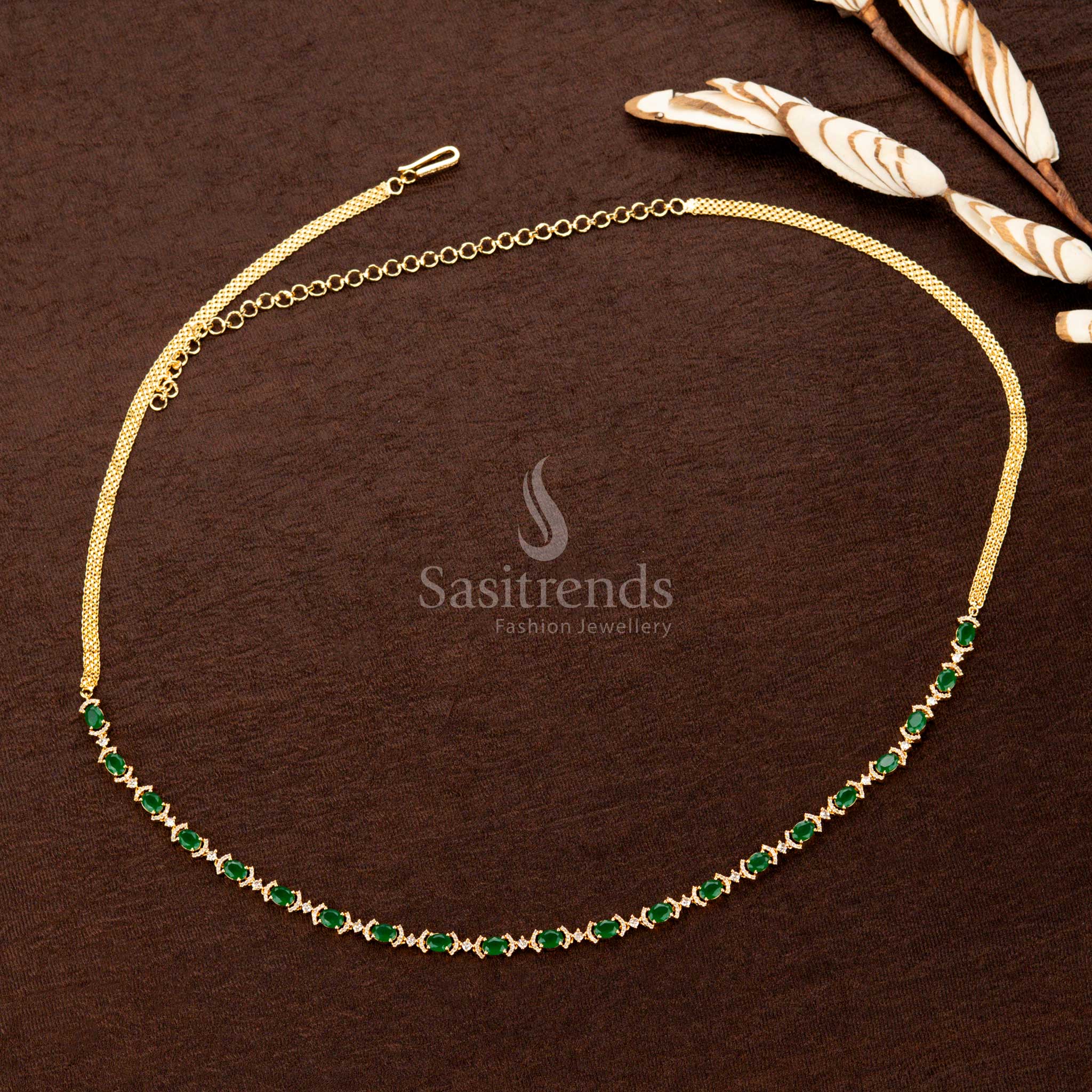 Emerald green gold-plated hip belt with shimmering American diamonds, elegant craftsmanship, and an adjustable fit—ideal for weddings and cultural celebrations - Sasitrends