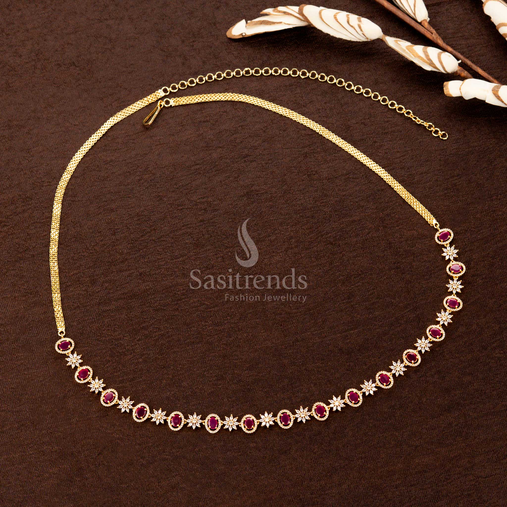 Radiant ruby American diamond hip chain with a glowing oval stone, classic floral detailing, and fine craftsmanship—an ideal jewellery piece for weddings and festive occasions - Sasitrends
