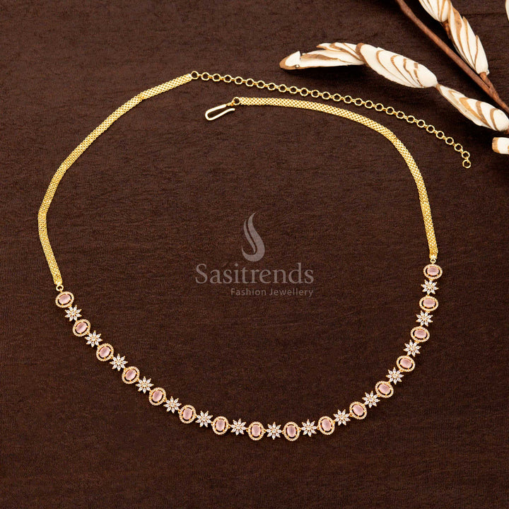 Blush pink gold-plated hip chain adorned with shimmering American diamonds, an exquisite oval gemstone, and a royal floral design—an elegant bridal accessory - Sasitrends