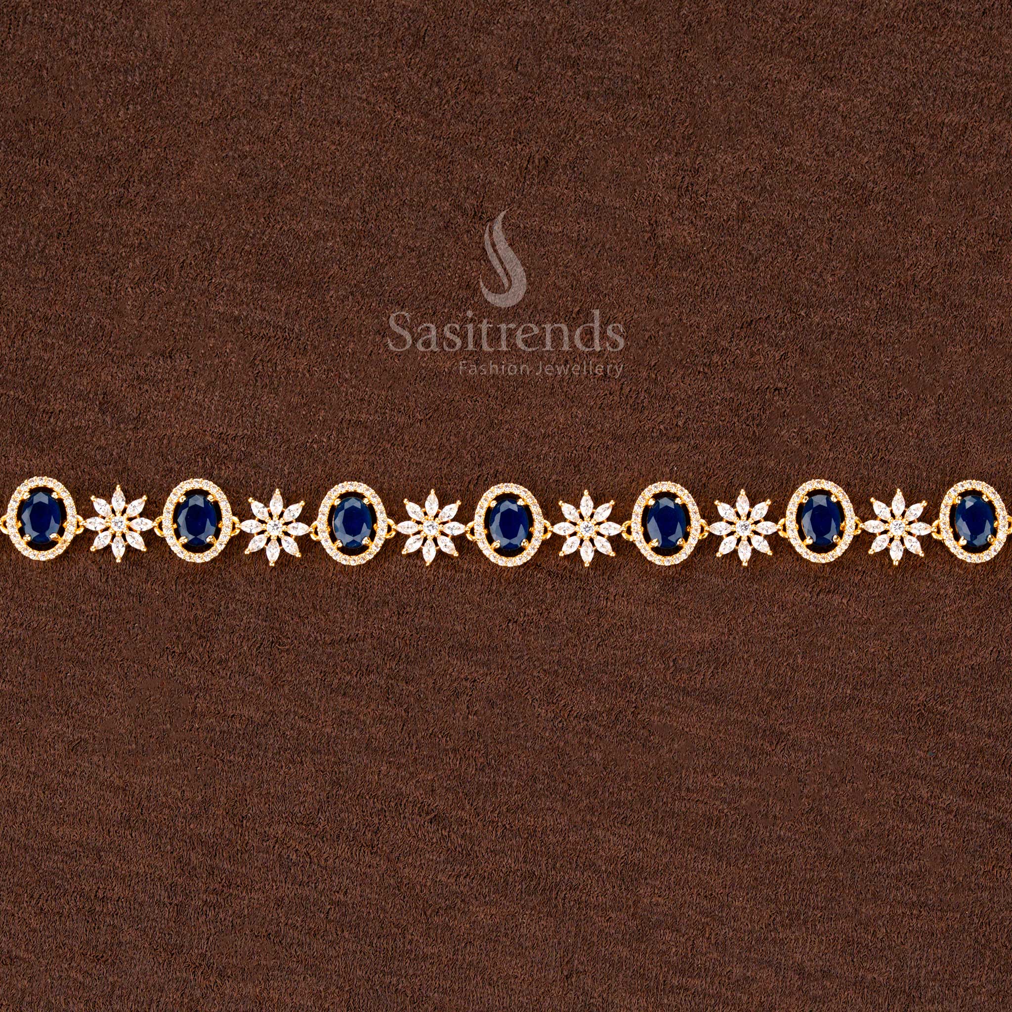 Deep blue gold-plated hip chain adorned with sparkling American diamonds, an oval centerpiece, and delicate floral detailing—ideal for bridal and festive occasions - Sasitrends