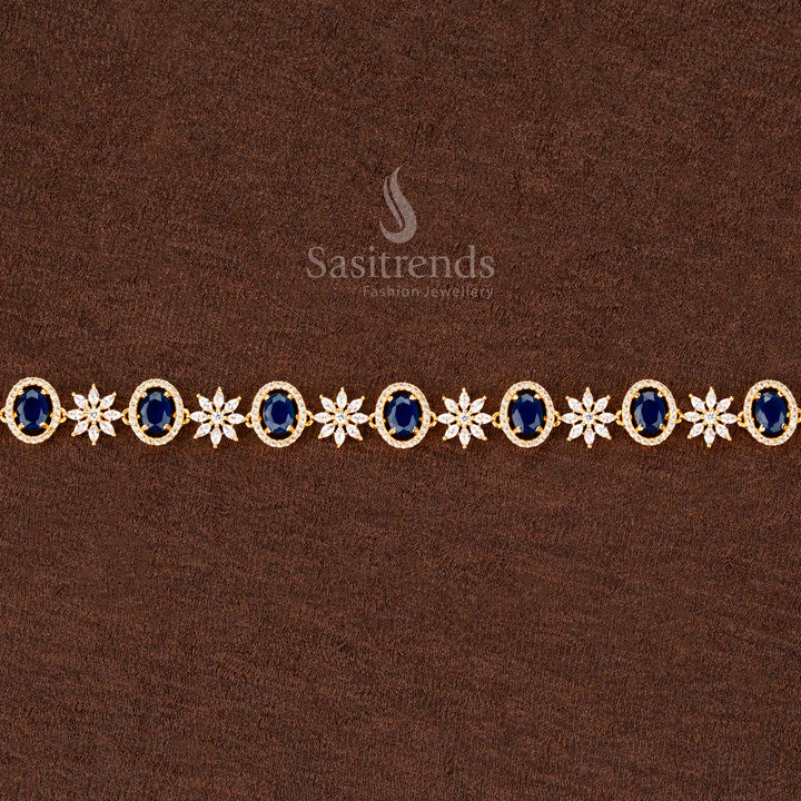 Deep blue gold-plated hip chain adorned with sparkling American diamonds, an oval centerpiece, and delicate floral detailing—ideal for bridal and festive occasions - Sasitrends