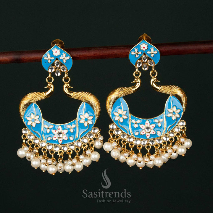 Graceful sky-blue gold plated painted peacock pearl earrings featuring intricate detailing, perfect for ethnic celebrations and festive elegance - Sasitrends