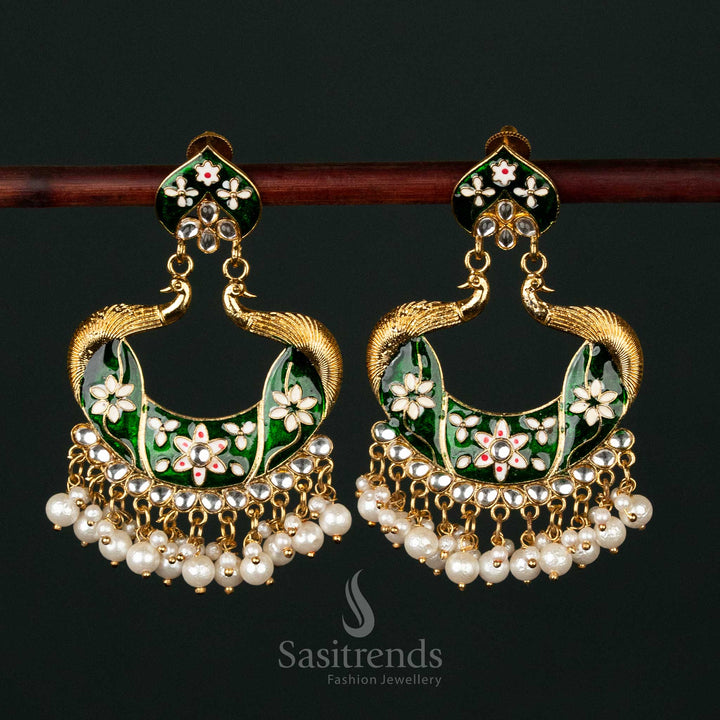 Enchanting green gold plated painted peacock pearl earrings with temple-inspired motifs, a timeless choice for cultural festivities - Sasitrends