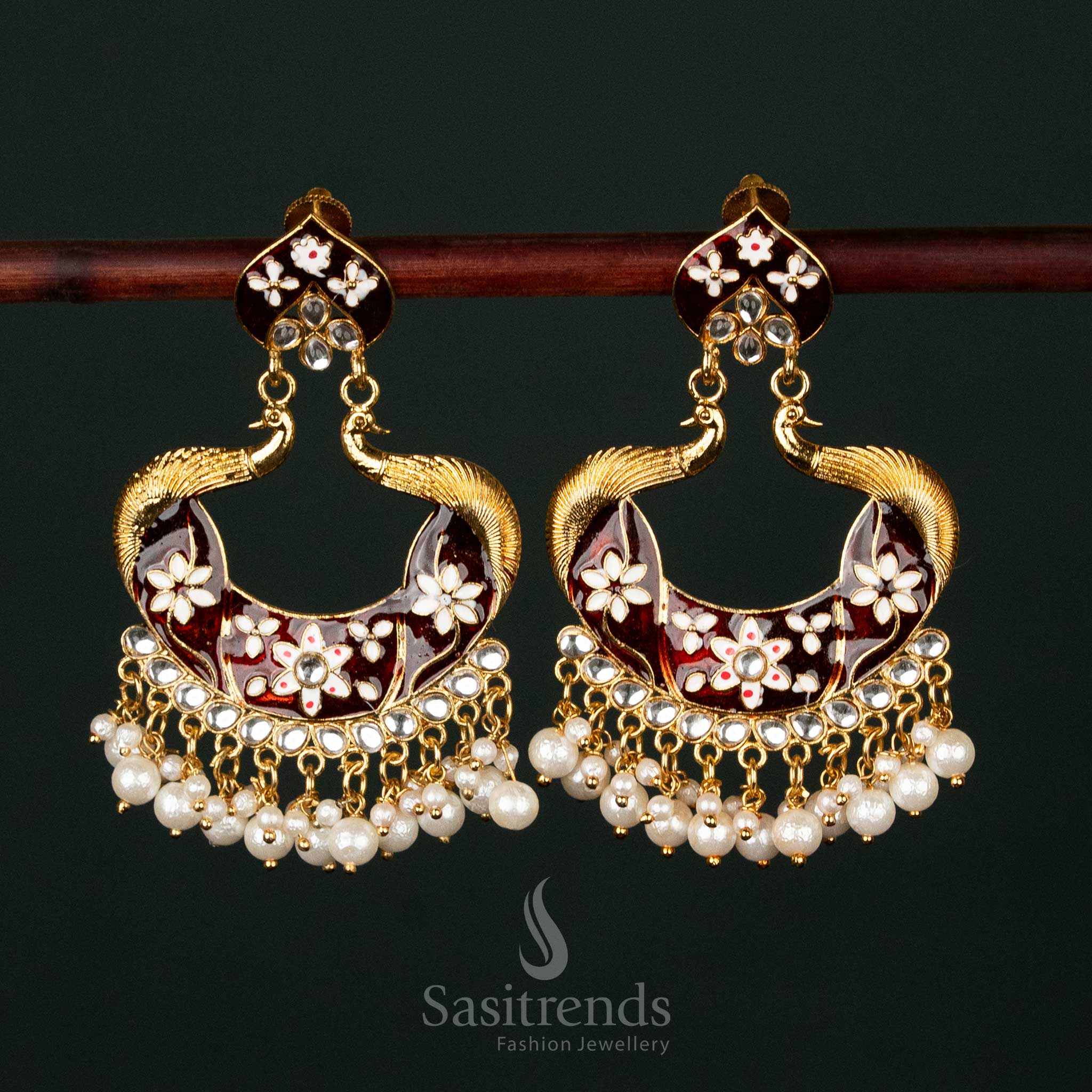 Exquisite maroon gold plated painted peacock pearl earrings adorned with intricate craftsmanship, ideal for grand bridal and traditional attire - Sasitrends