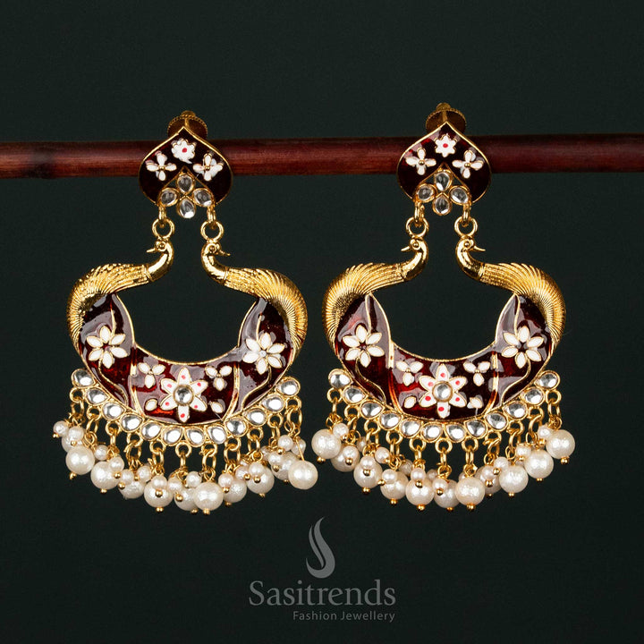 Exquisite maroon gold plated painted peacock pearl earrings adorned with intricate craftsmanship, ideal for grand bridal and traditional attire - Sasitrends