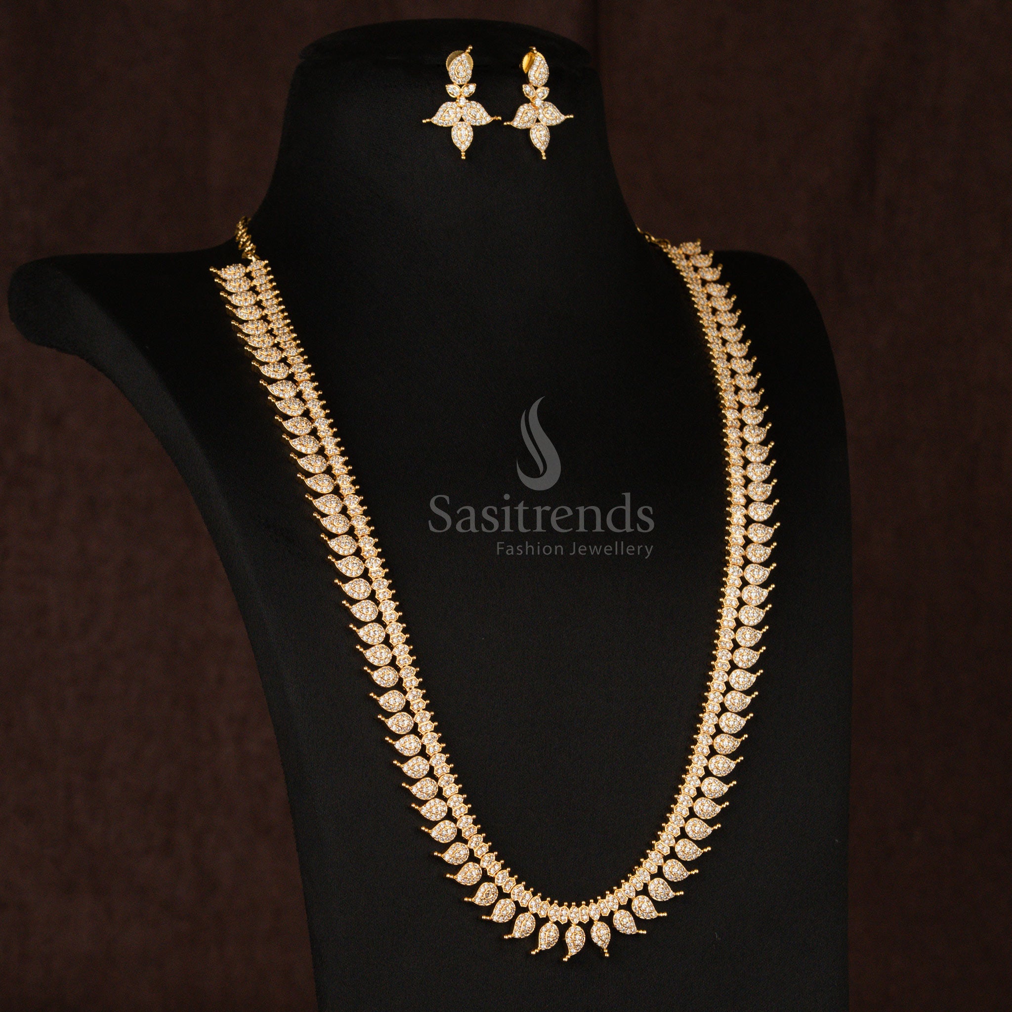 Classic pearl-white American Diamond gold plated mango leaf Long haram necklace set, exuding a timeless appeal, perfect for elegant traditional jewellery lovers