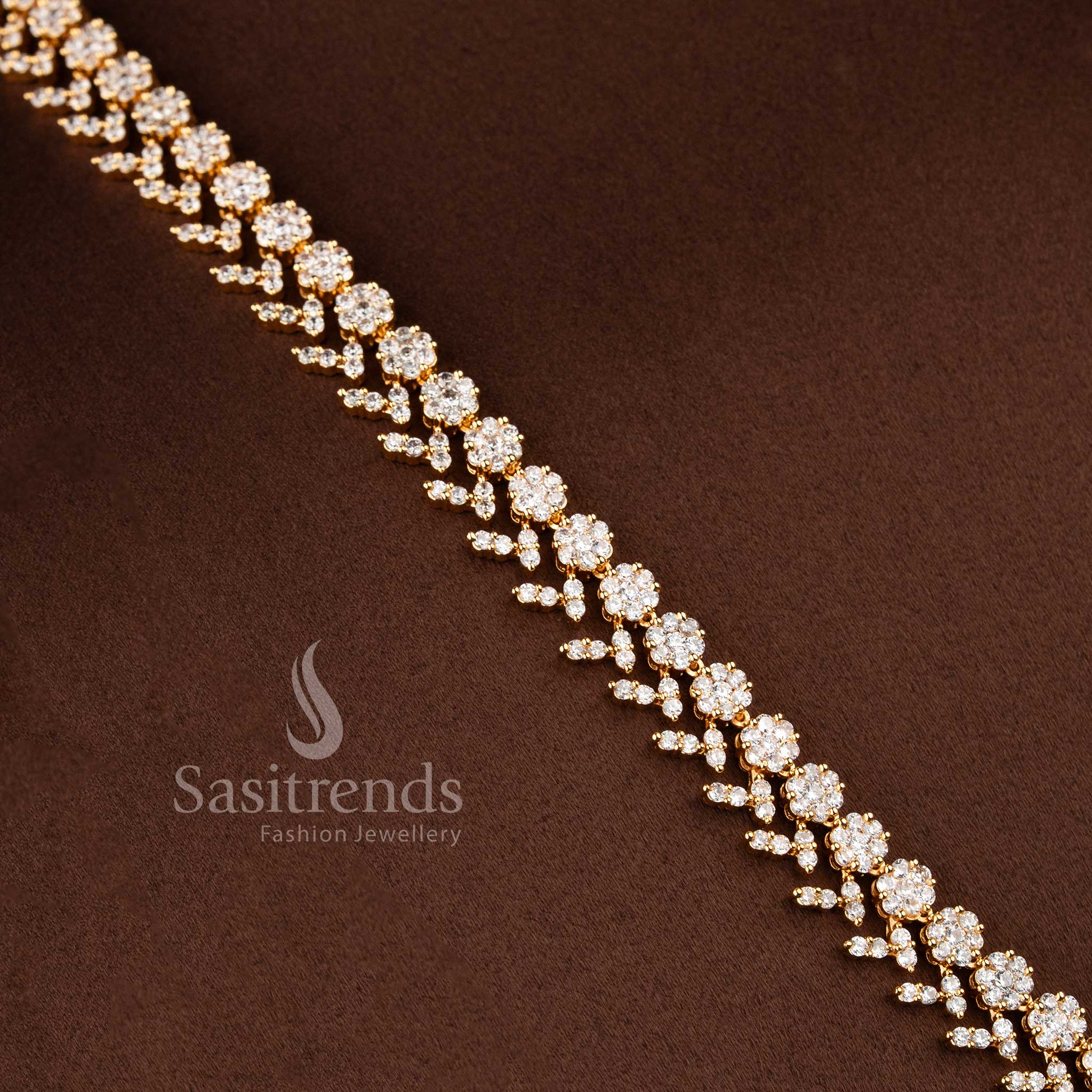 Elegant bridal-style AD stone layered necklace ensemble with a floral starburst pendant.