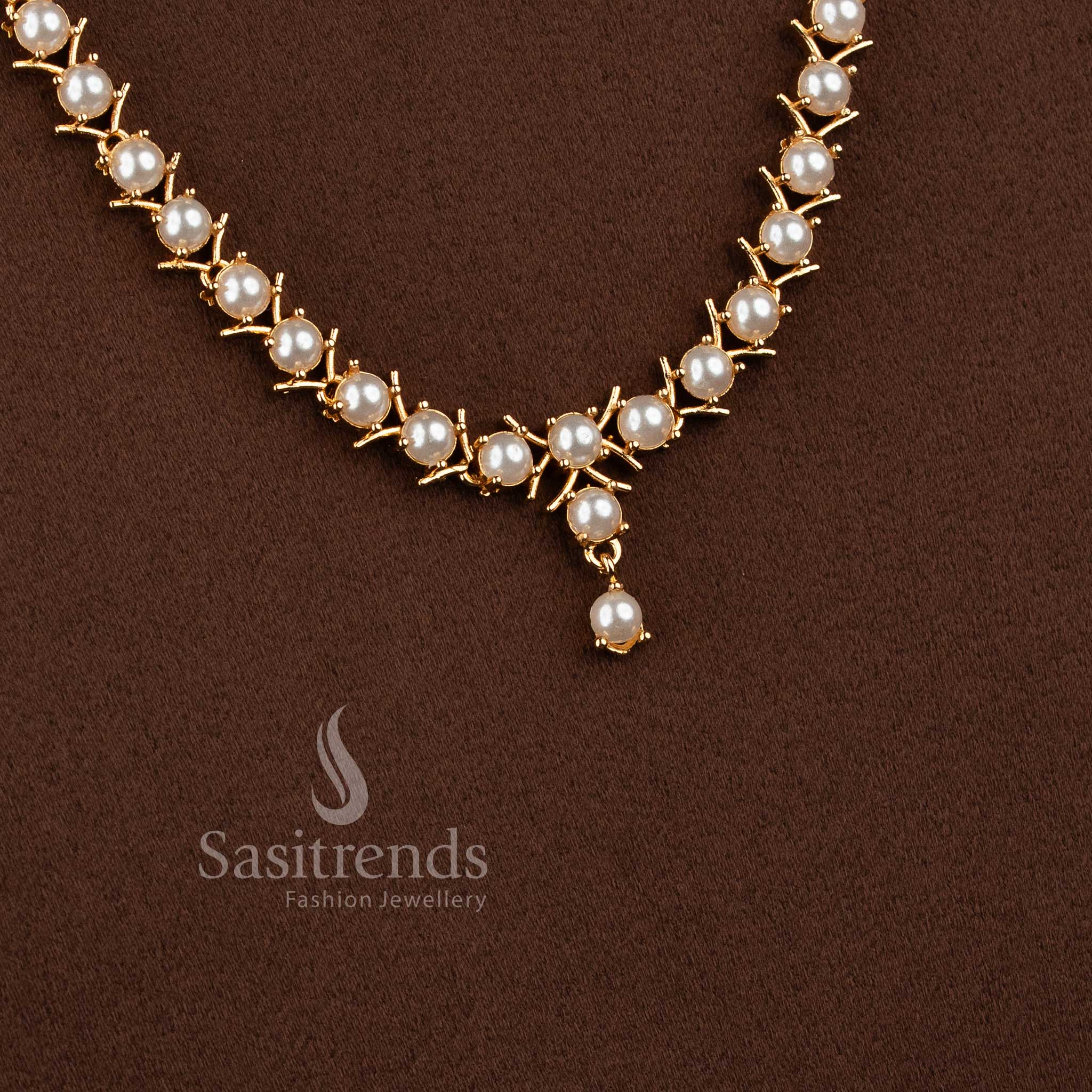 Traditional micro gold plated pearl long necklace set with American Diamond accents.