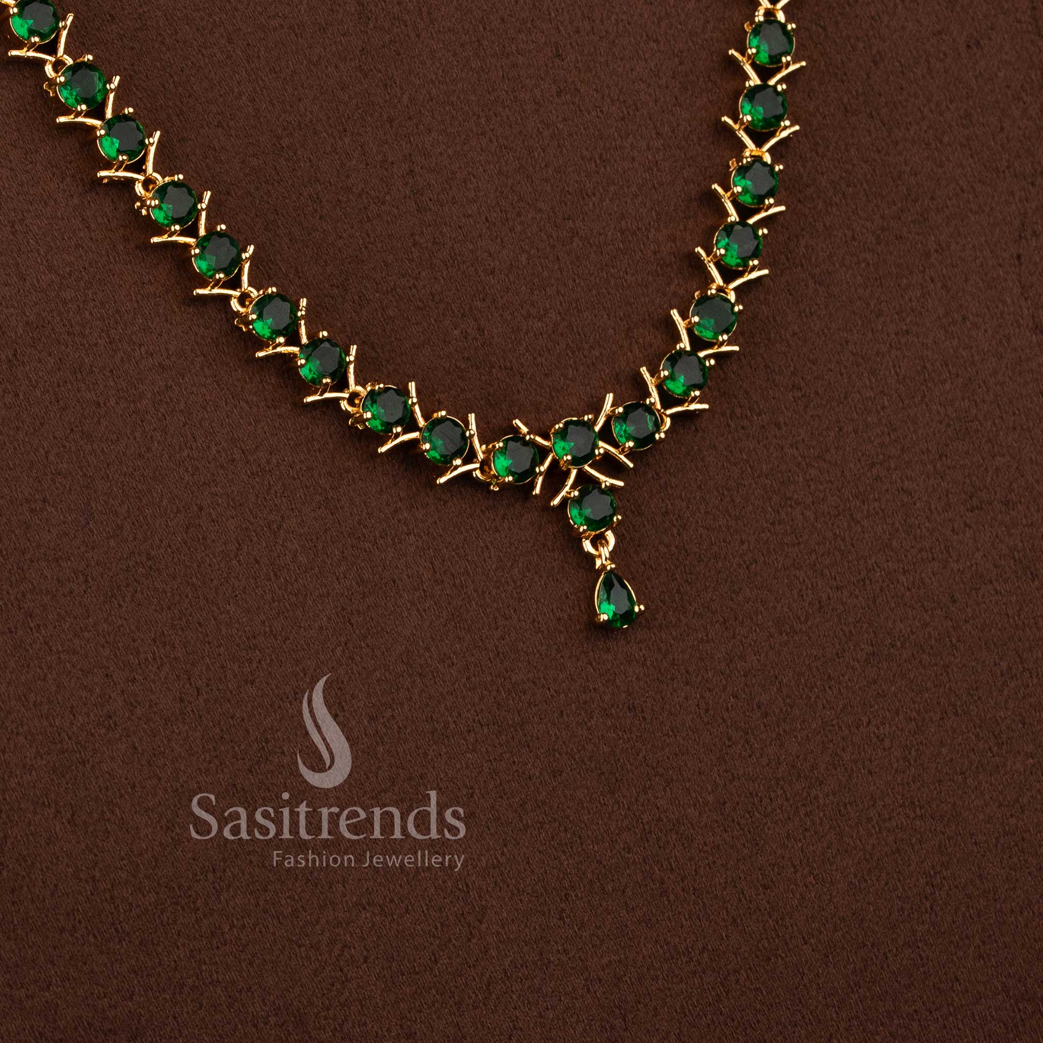 Elegant long necklace set with green stones and sparkling American Diamond accents for women.