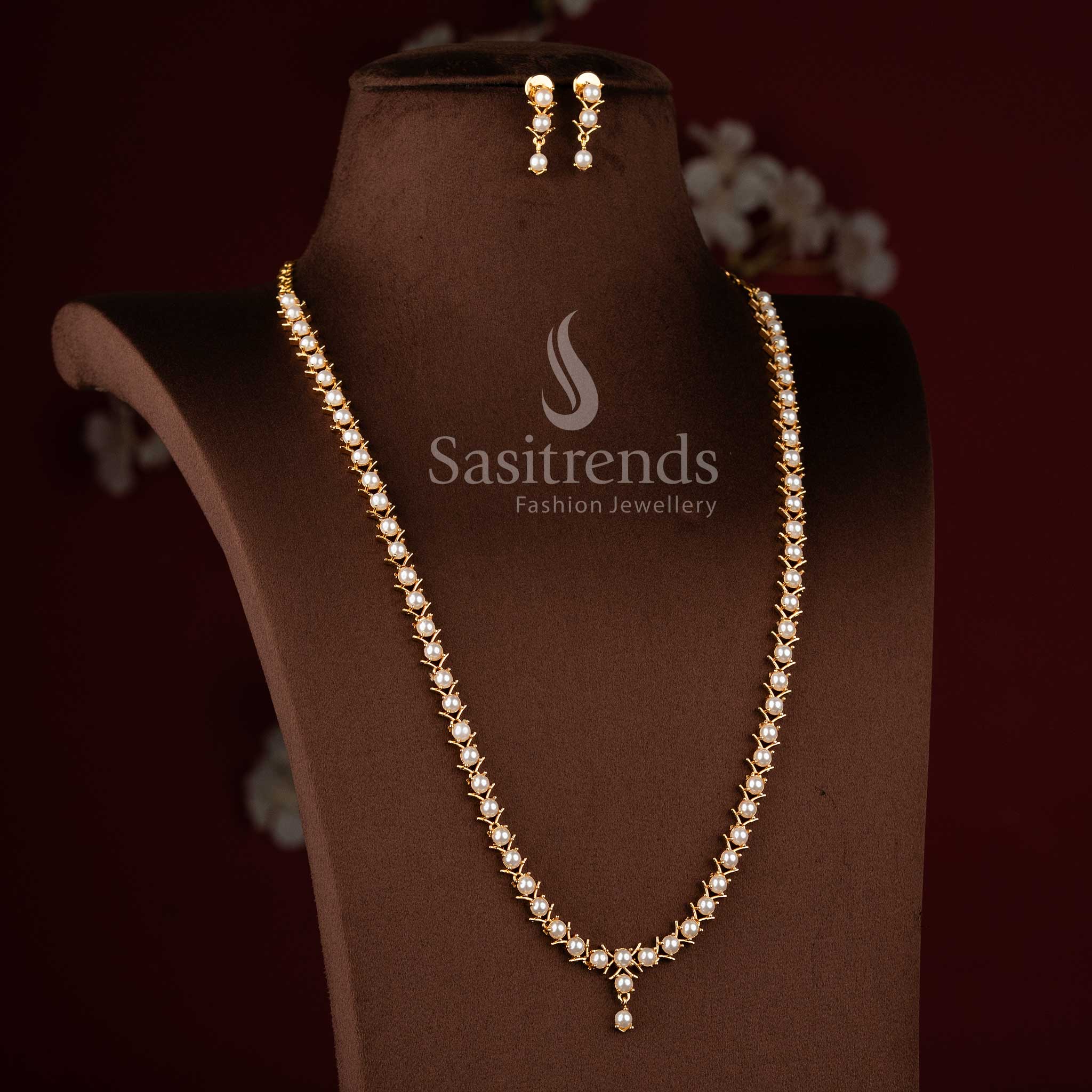 Traditional micro gold plated pearl long necklace set with American Diamond accents.