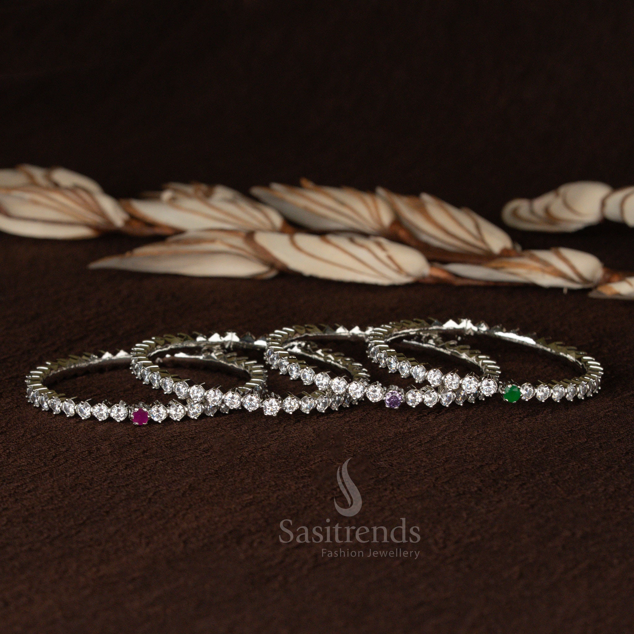 Regal rhodium plated bracelet bangle adorned with big round stones and sparkling American diamonds, crafted for festive grandeur - Sasitrends