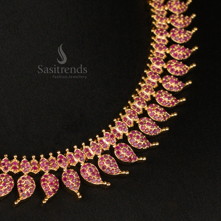 Lustrous micro gold plated leaf mango short haram necklace set, enhanced with royal ruby stones, making it a luxurious addition to any bridal jewellery collection - Sasitrends