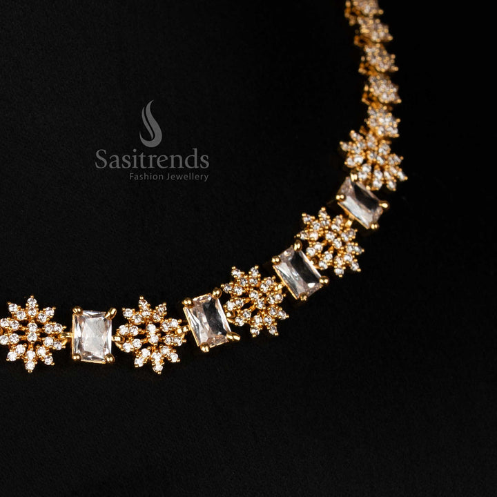 Detailed view of sparkling American Diamond micro gold plated necklace, highlighting the intricate starburst clusters and prominent rectangular-cut American Diamonds - Sasitrends