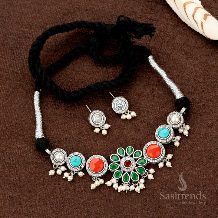 Elegant oxidised choker adorned with floral engraving, central multistone pendant, and graceful pearl dangles, a rich piece of Indian festive jewellery - Sasitrends
