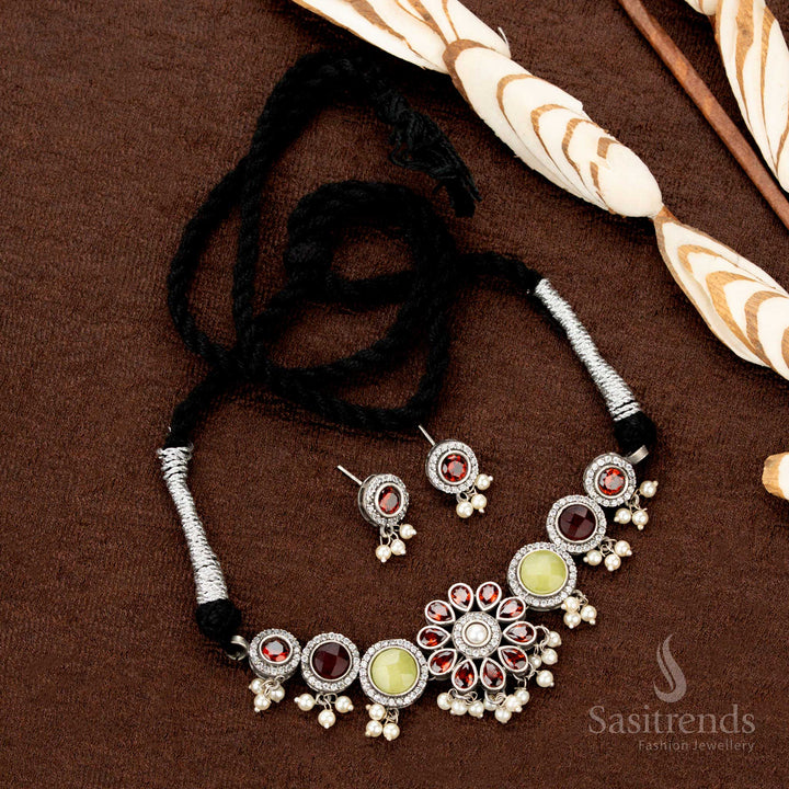 Antique finish choker necklace with oxidised floral design, pearl detailing, and festive hues—perfect for Navaratri traditional jewellery collections - Sasitrends