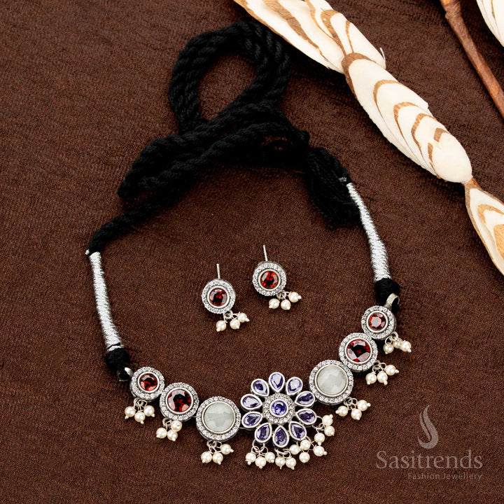Oxidised choker set with multistone inlay, floral detailing, and pearl embellishments—a stunning jewellery piece with a traditional festive vibe - Sasitrends