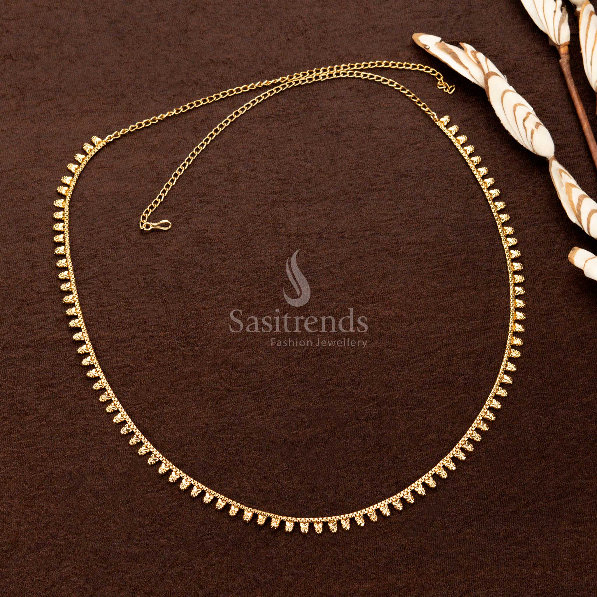 Gold plated waist chain with embossed floral-leaf motif hangings - Sasitrends