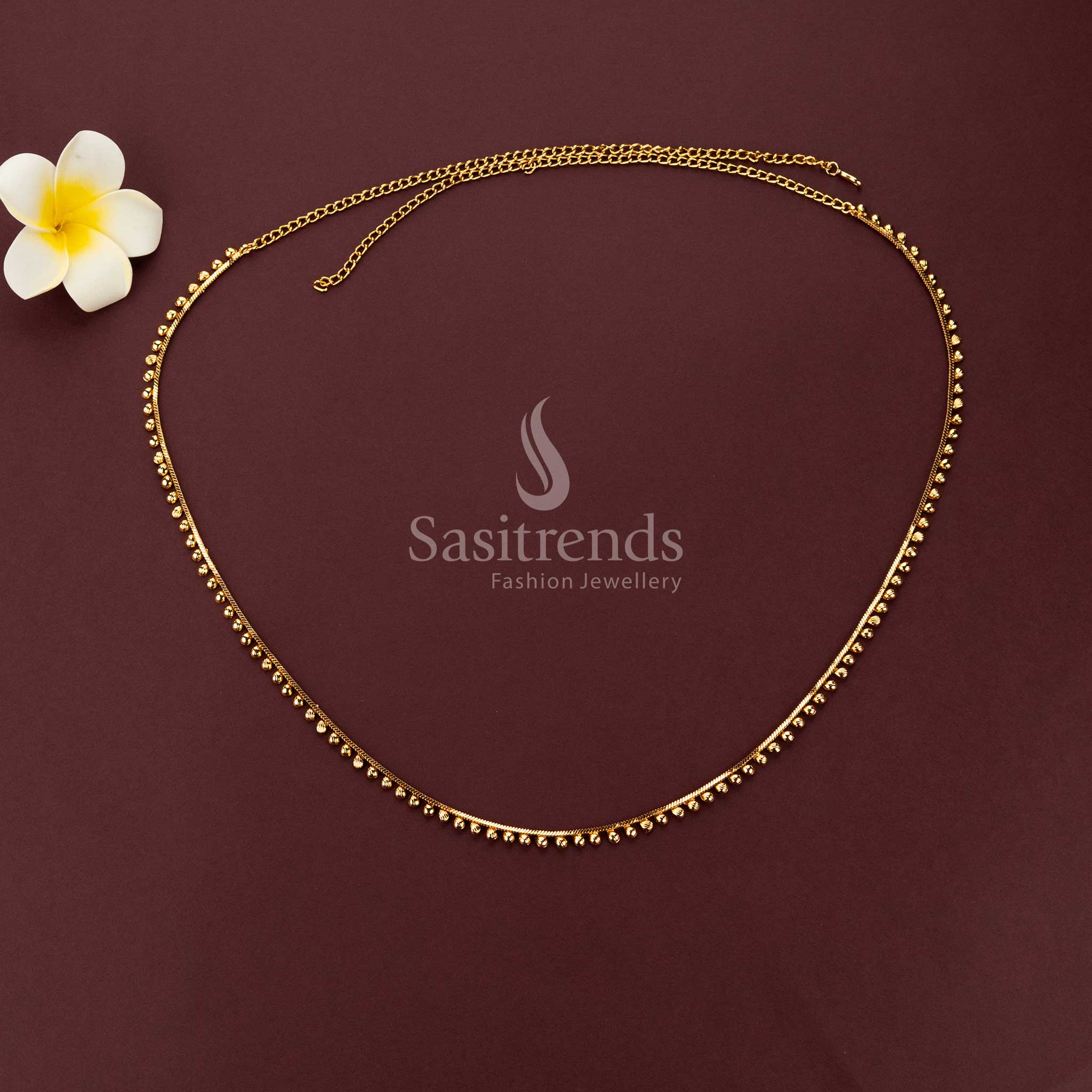 Elegant waist chain with golden bead drops on one side in minimal design suitable for saree and festive wear - Sasitrends