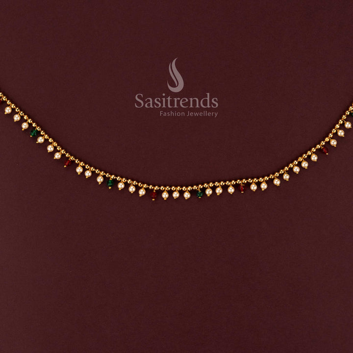 Close-up of elegant single line hip belt featuring small pearls and colorful bead accents 