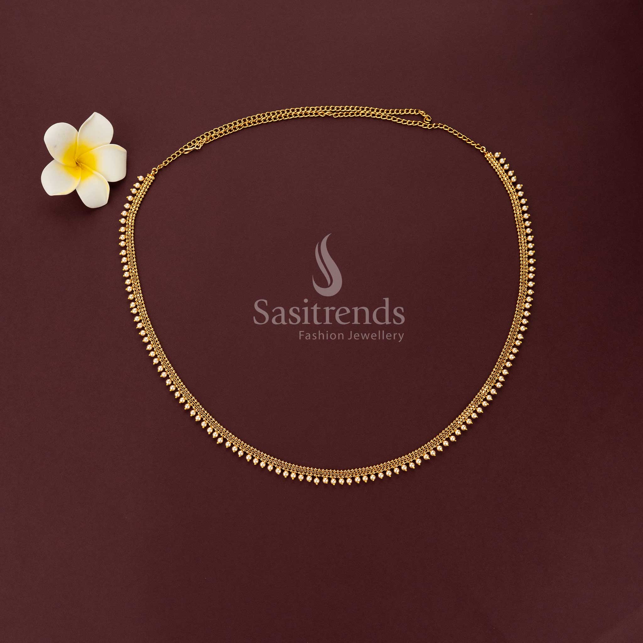 Luxurious layered gold bead waist chain with hanging pearls for bridal sarees - Sasitrends