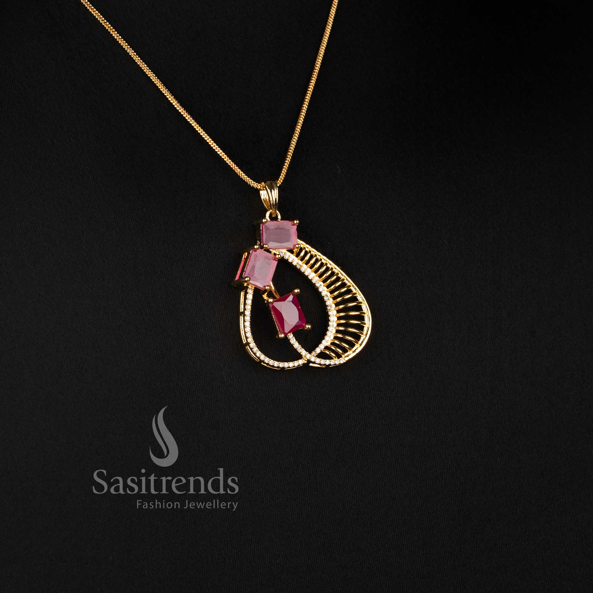 American Diamond Micro Gold Plated Ruby Pendant Chain Necklace Set with matching feather-inspired earrings for festive and party wear - Sasitrends