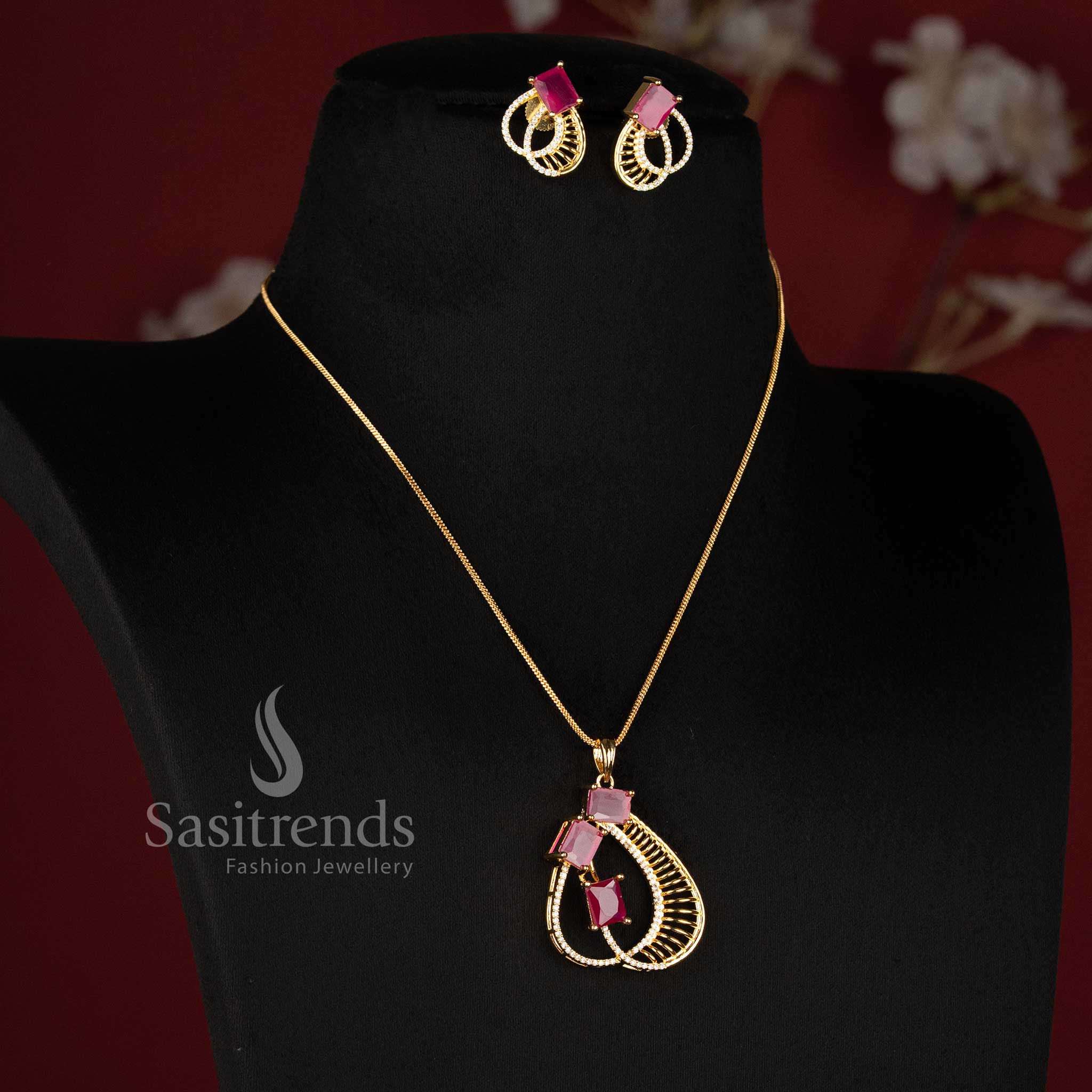 American Diamond Micro Gold Plated Ruby Pendant Chain Necklace Set with matching feather-inspired earrings for festive and party wear - Sasitrends