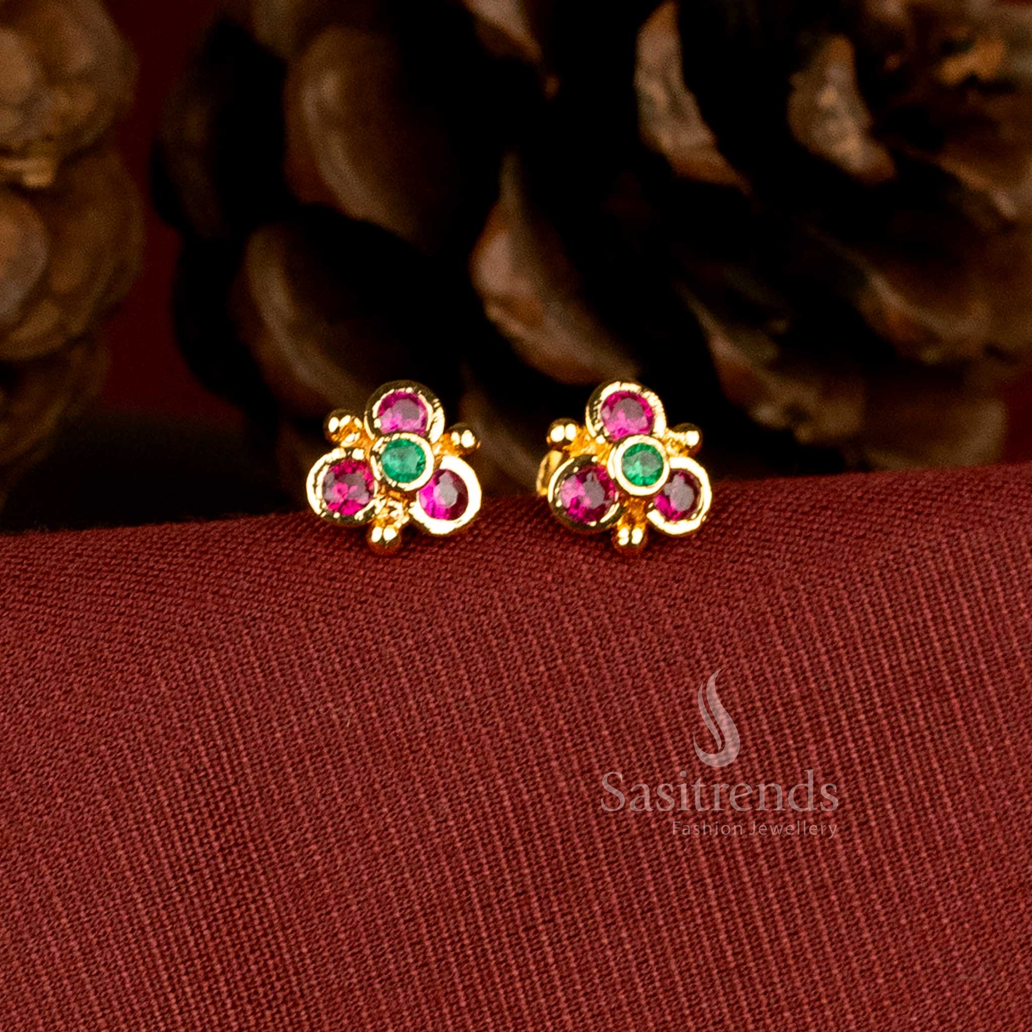 Gold look floral design stud earrings with AD stones by Sasitrends