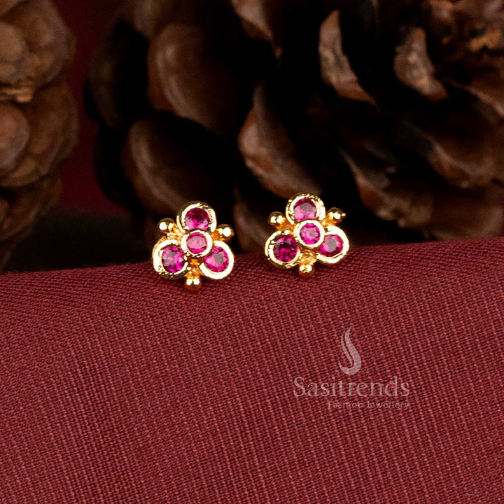 Gold look floral design stud earrings with AD stones by Sasitrends