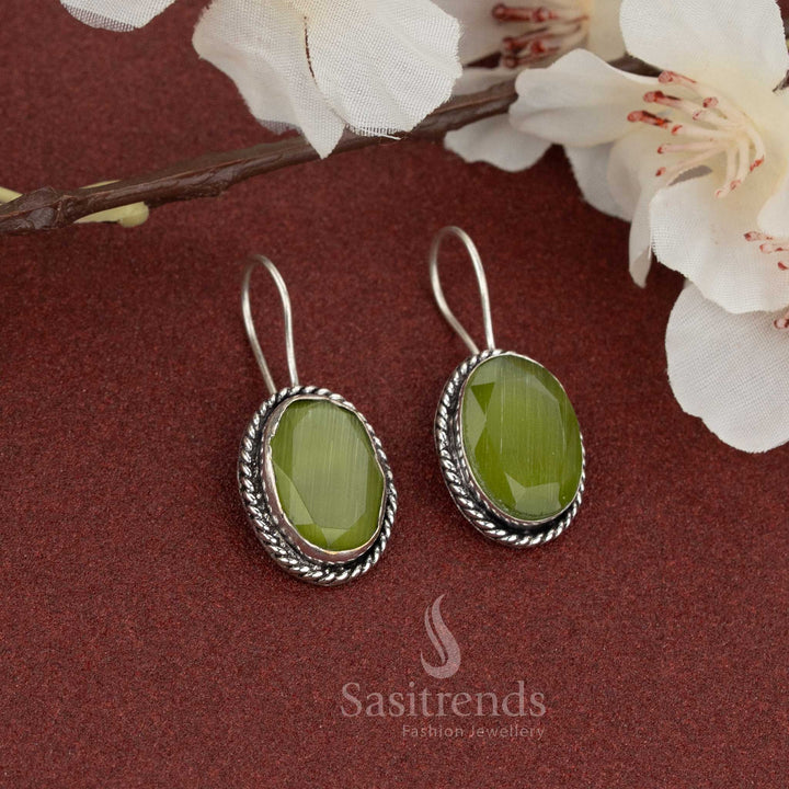 Amazing casual wear oxidised fish hook earrings featuring oval olive-green natural stone and twisted rope border – perfect for earthy-toned daily outfits – Sasitrends