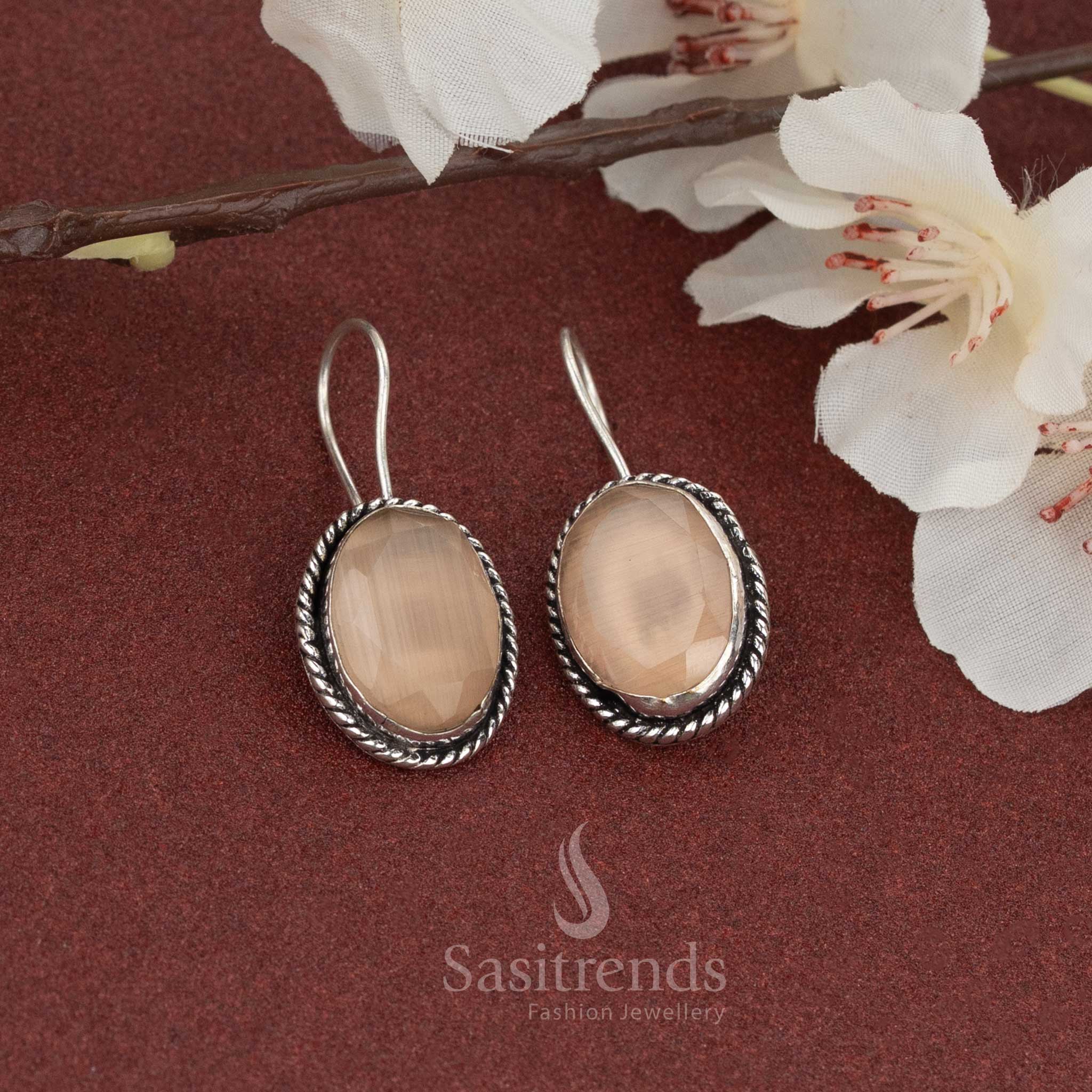 Elegant casual wear oxidised fish hook earrings with soft peach oval stone and silver rope frame – a soothing choice for daily looks – Sasitrends