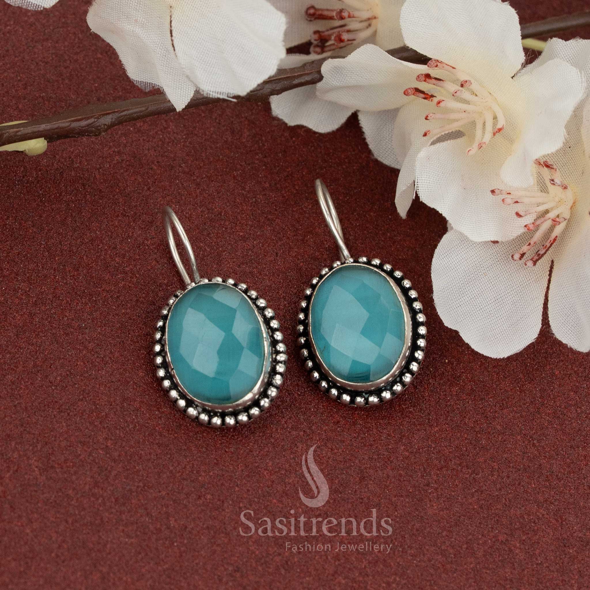 Oxidised fish hook earrings with ocean-blue oval stone – soft shimmer and rope detailing make it perfect for breezy casual styles – Sasitrends