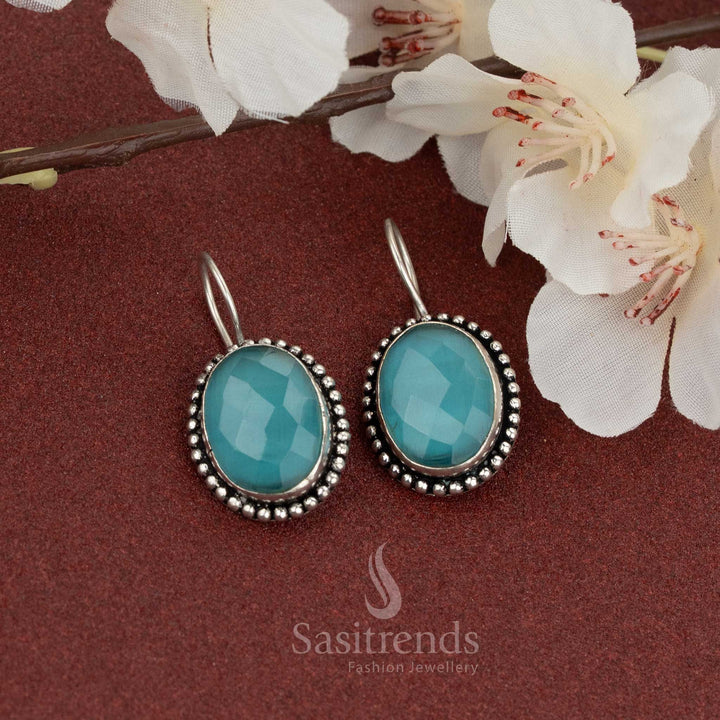 Oxidised fish hook earrings with ocean-blue oval stone – soft shimmer and rope detailing make it perfect for breezy casual styles – Sasitrends