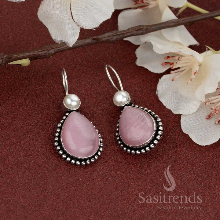 Charming pink teardrop stone earrings in oxidised finish, topped with pearls – for subtle festive looks – Sasitrends