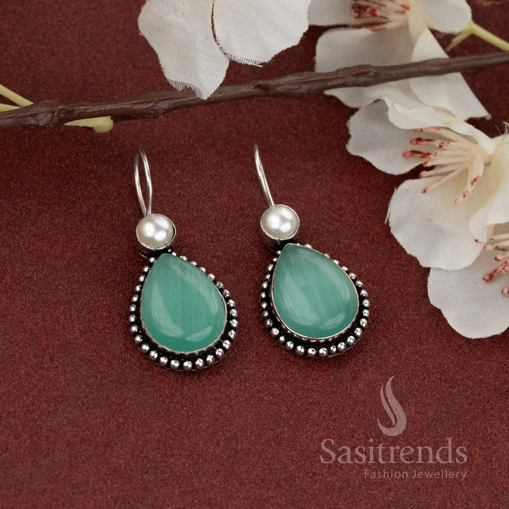 Mint oxidised silver earrings with soft green teardrop stone and pearl stud – ideal for relaxed, elegant wear – Sasitrends