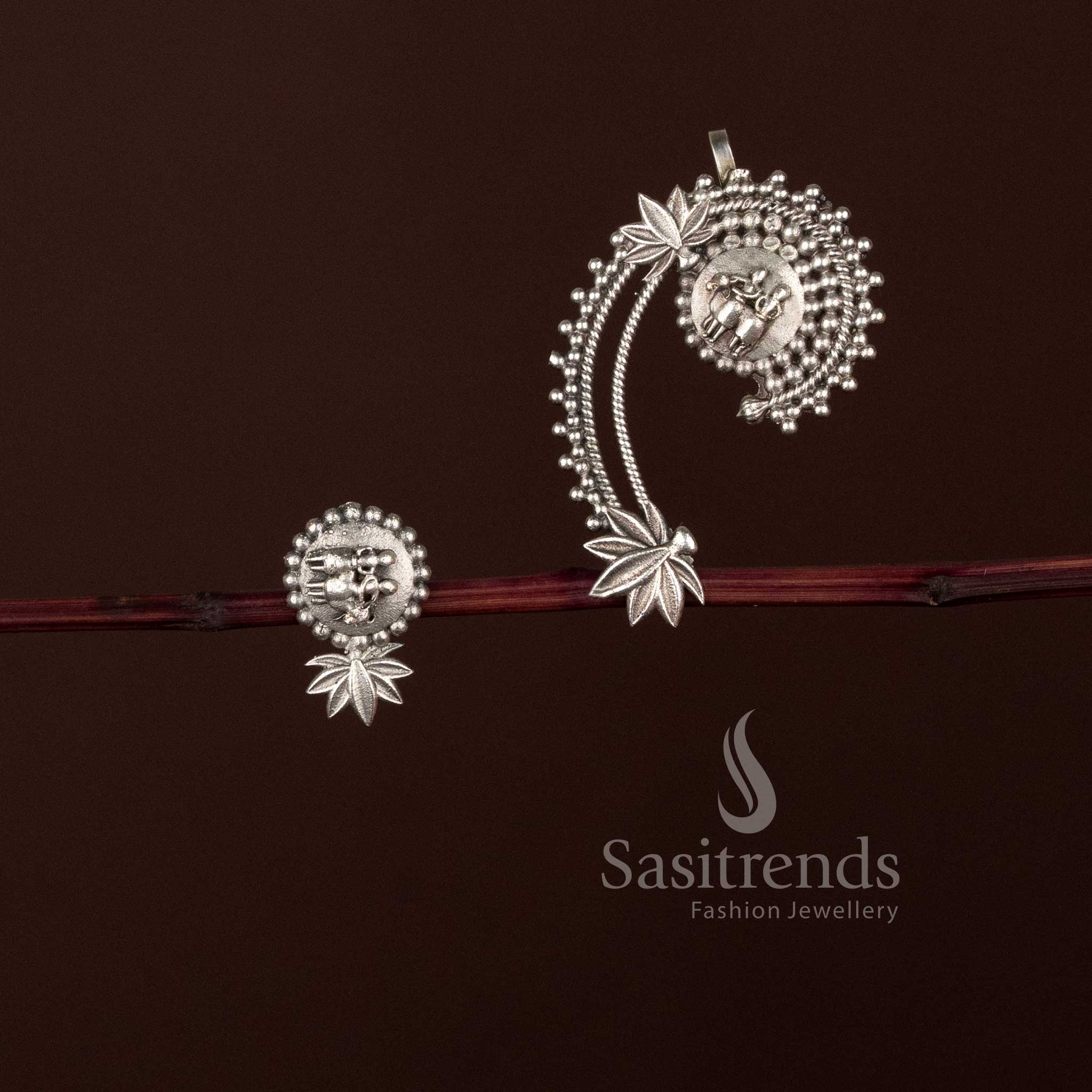 Sasitrends antique oxidised silver sweeping paisley floral motif ear cuff earrings featuring ethnic heritage inspired detailing, sculpted curved design, premium oxidised finish, and artistic ear cuff styling suitable for traditional and contemporary outfits.