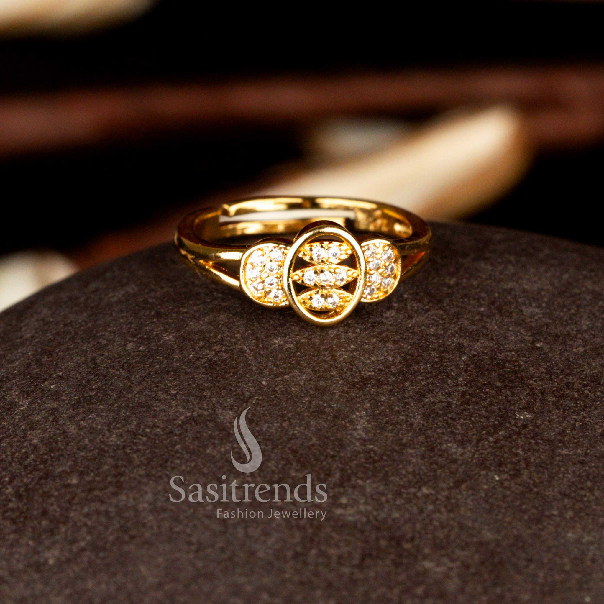 Sasitrends premium one gram micro gold plated adjustable ring crafted with precision set center round white AD stones and rich gold tone polish offering an elegant and versatile styling option.