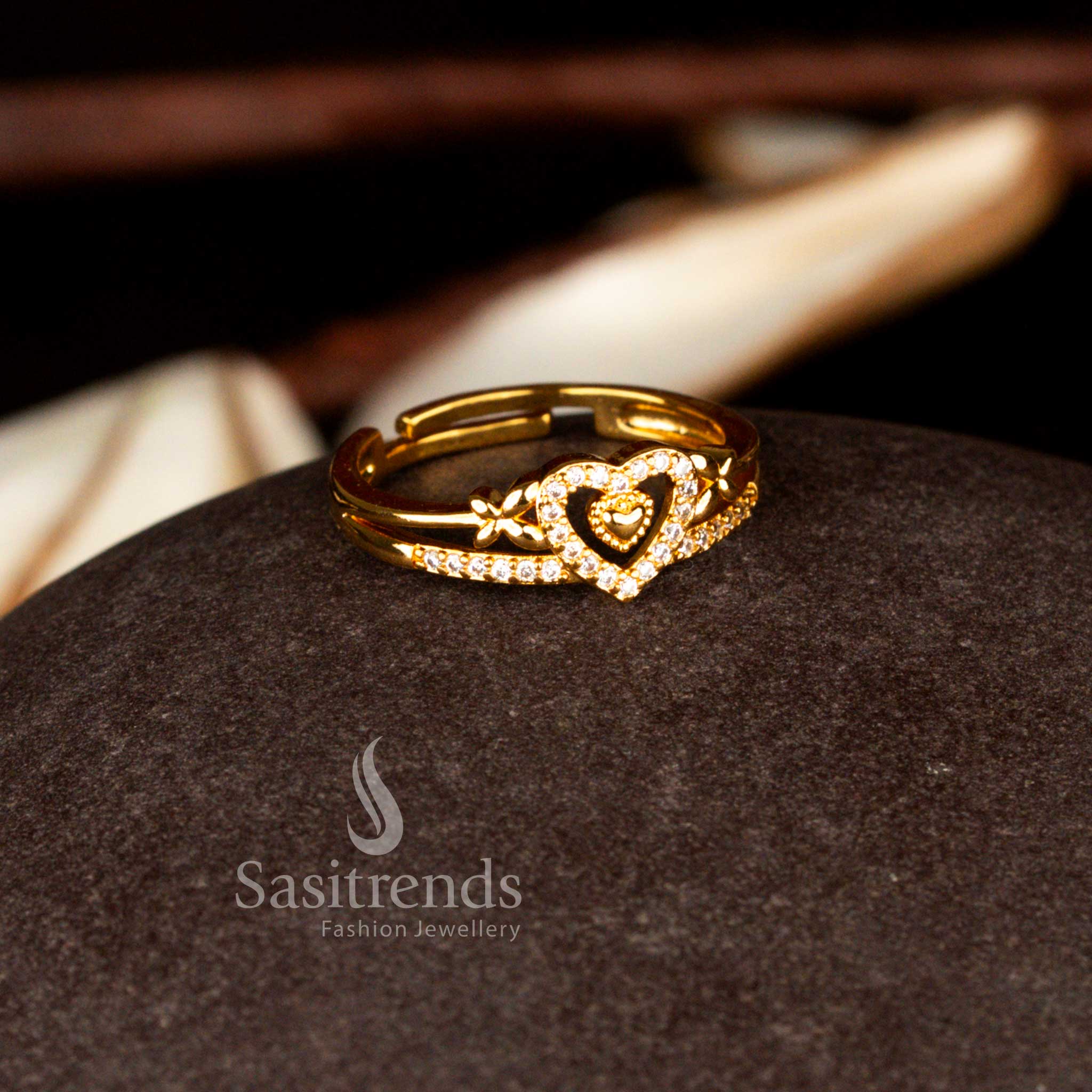 Sasitrends classic one gram micro gold plated adjustable dual heart motif white AD statement ring featuring a polished gold tone finish and refined stone setting ideal for party and ethnic wear.