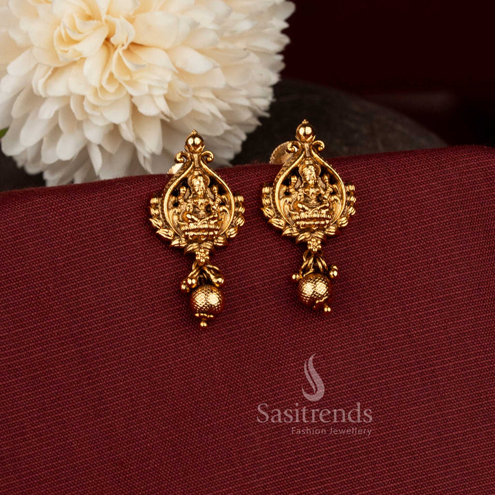 Graceful Premium Temple Matte Gold Plated Lakshmi Devi Motif Drop Earrings with Textured Bead Hangings | Rich Look Quality