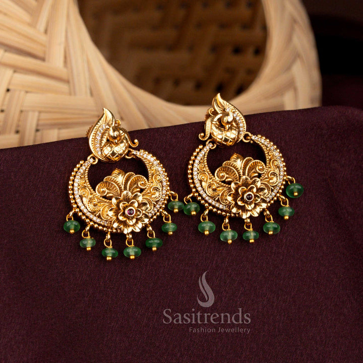 Regal white ruby peacock crescent floral earrings crafted in matte gold, adorned with radiant AD brilliance, heritage artistry, and pearl elegance – Sasitrends