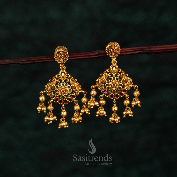 Grandiose ruby green teardrop earrings with layered floral AD embellishments, radiant matte gold artistry, noble craftsmanship, and celestial wedding grandeur – Sasitrends