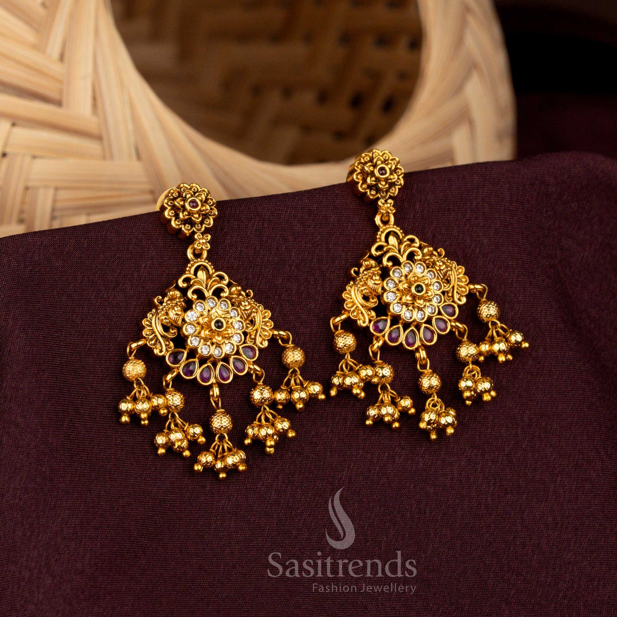 Beautiful Multi colors teardrop earrings with layered floral AD embellishments, radiant matte gold artistry, noble craftsmanship, and celestial wedding grandeur – Sasitrends