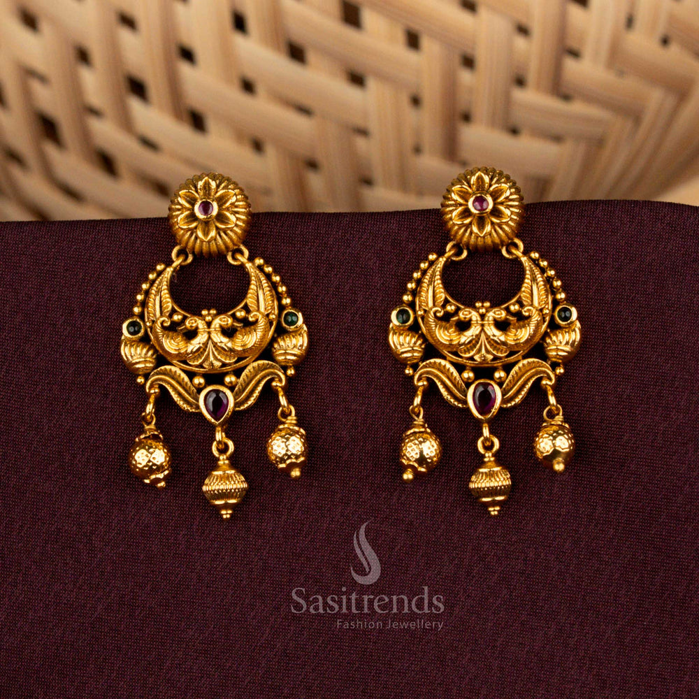 Majestic ruby green temple earrings showcasing divine peacock artistry, floral AD brilliance, matte gold elegance, and noble refinement created for splendid bridal celebrations – Sasitrends
