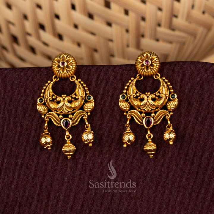Majestic ruby green temple earrings showcasing divine peacock artistry, floral AD brilliance, matte gold elegance, and noble refinement created for splendid bridal celebrations – Sasitrends