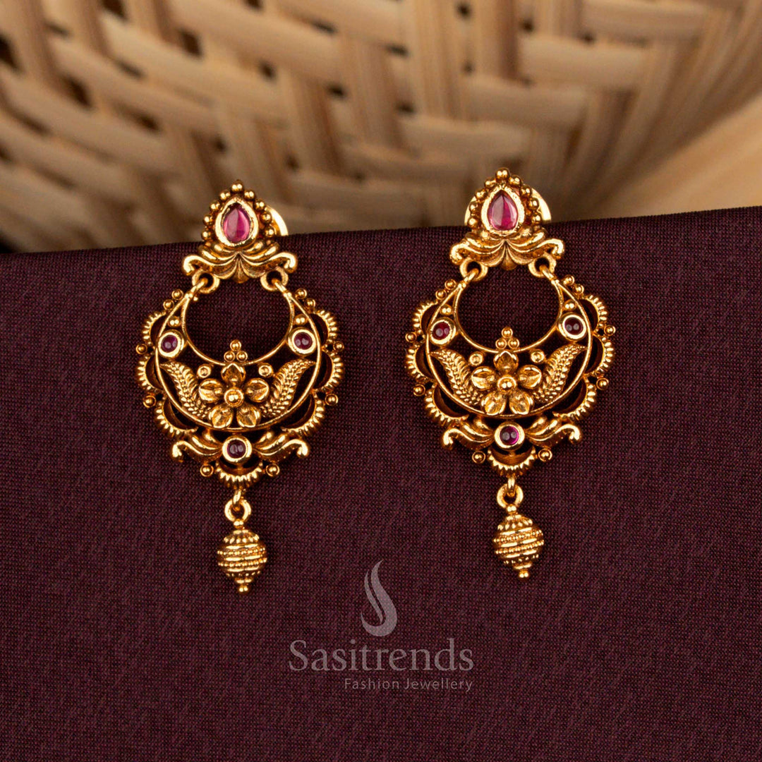 Regal ruby teardrop earrings crafted in matte gold with floral AD brilliance, aristocratic artistry, and splendid refinement designed for weddings – Sasitrends