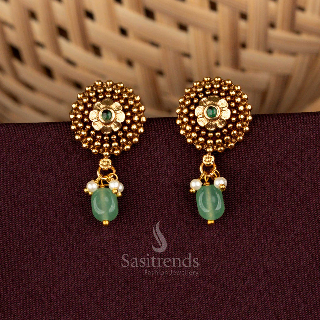 Eternal green circular floral temple earrings styled with divine matte gold detailing, ornate beaded embellishments, sacred AD brilliance, and noble artistry created for weddings – Sasitrends