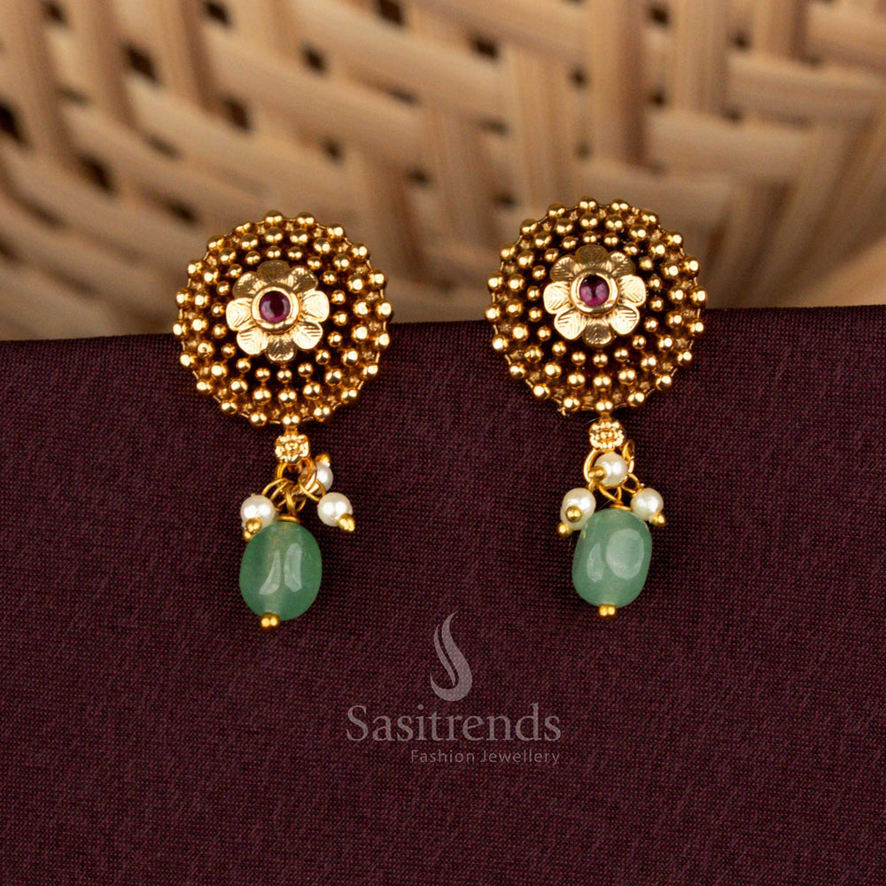 Grandiose ruby circular floral temple earrings adorned with matte gold artistry, ornate beaded danglers, opulent AD brilliance, and aristocratic heritage refinement for splendid weddings – Sasitrends