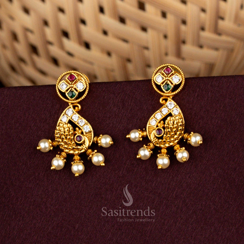 Illustrious multicolor paisley peacock stud earrings adorned with matte gold finish, celestial AD accents, noble pearl elegance, and opulent artistry perfect for weddings – Sasitrends